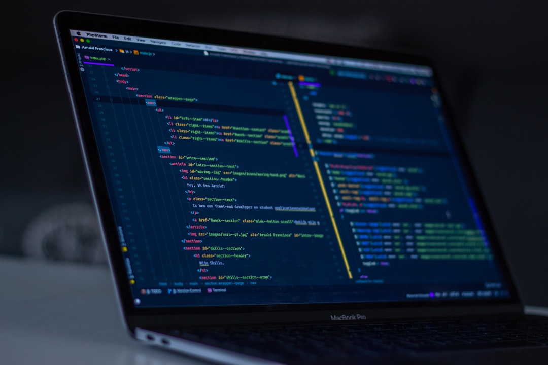 Developer coding on a laptop